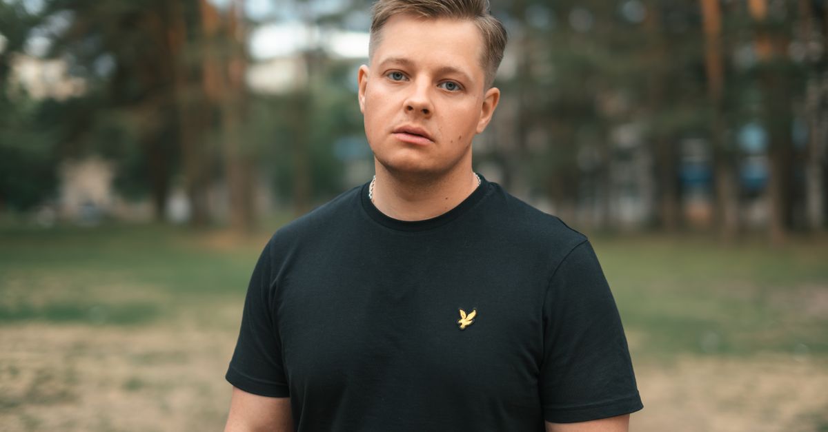 Young man with a short crop, a common choice alongside androgenetic alopecia in trans men