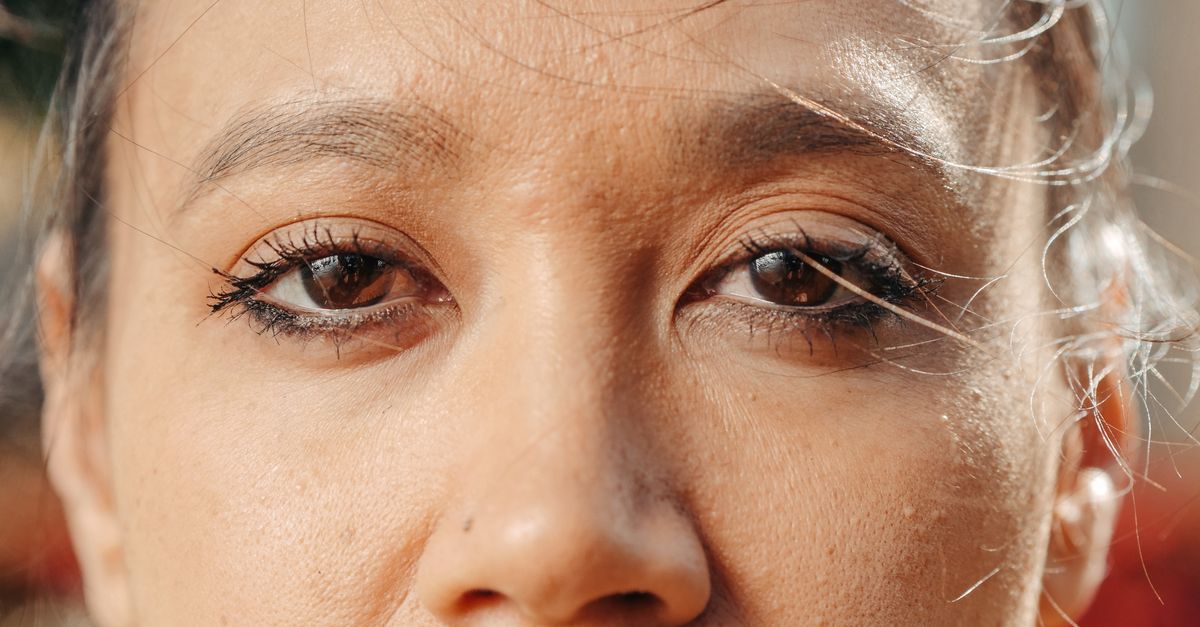 Close-up of a woman's eyes and brows in natural light, the area a botox brow lift is intended to change