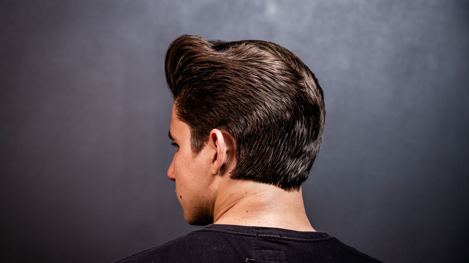 Close up of the back of a man's head showing the crown, where crown hair thinning usually appears first