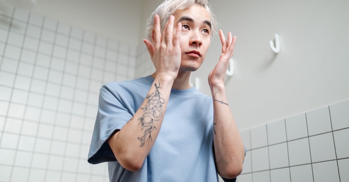 Man in his bathroom routine, thinking through hair loss treatments 2026