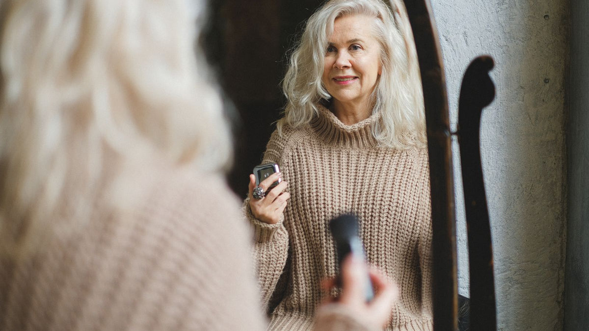 Senior woman with silver hair showing natural hair pigmentation change
