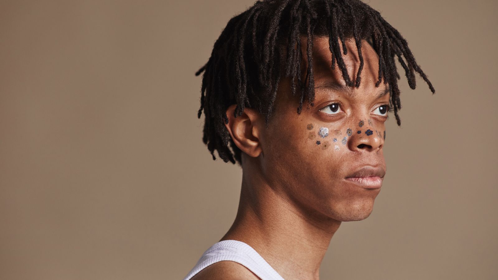 Person with healthy dreadlocks resting neatly on the shoulders