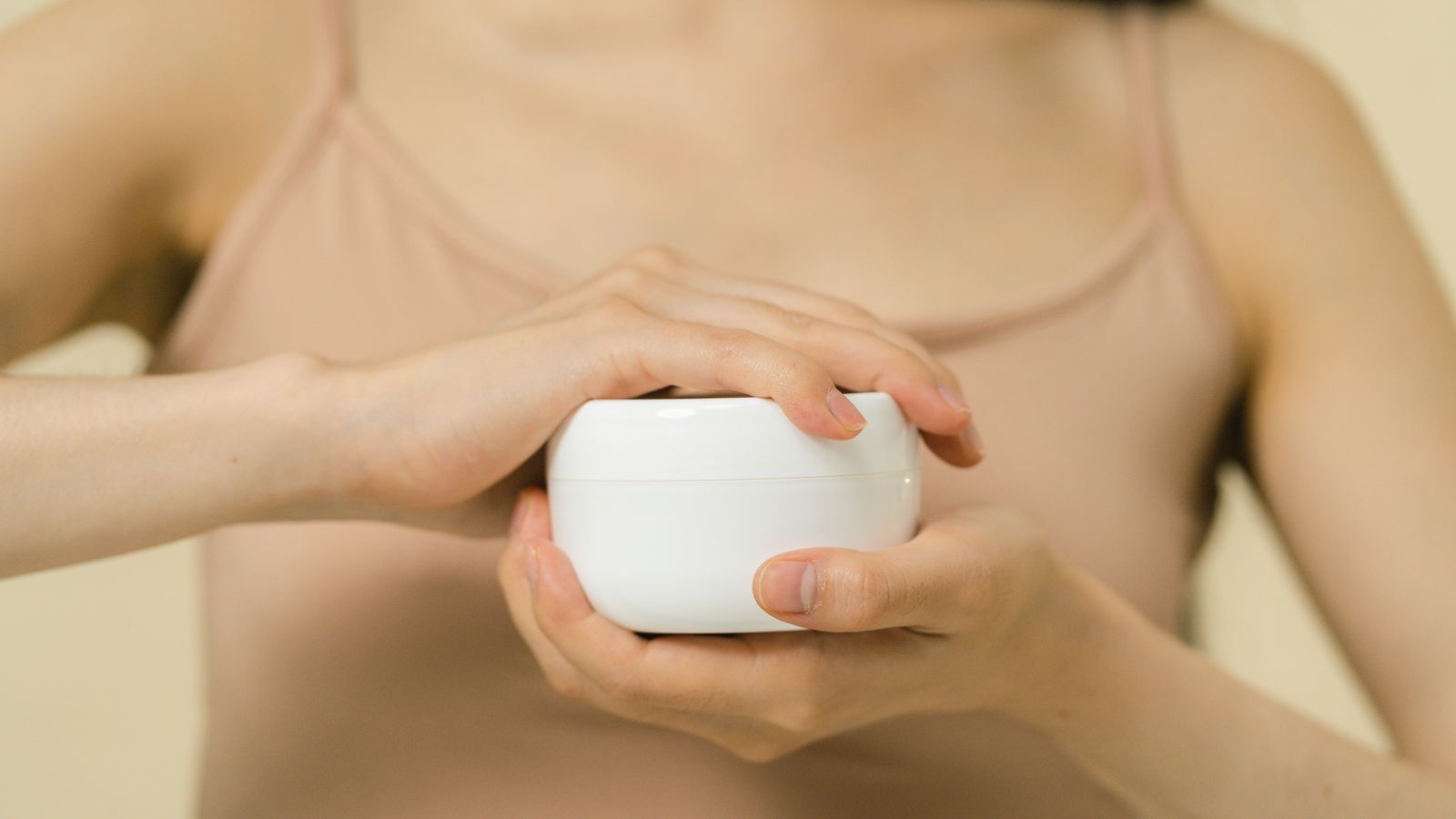 Applying hand cream to rescue dry hands