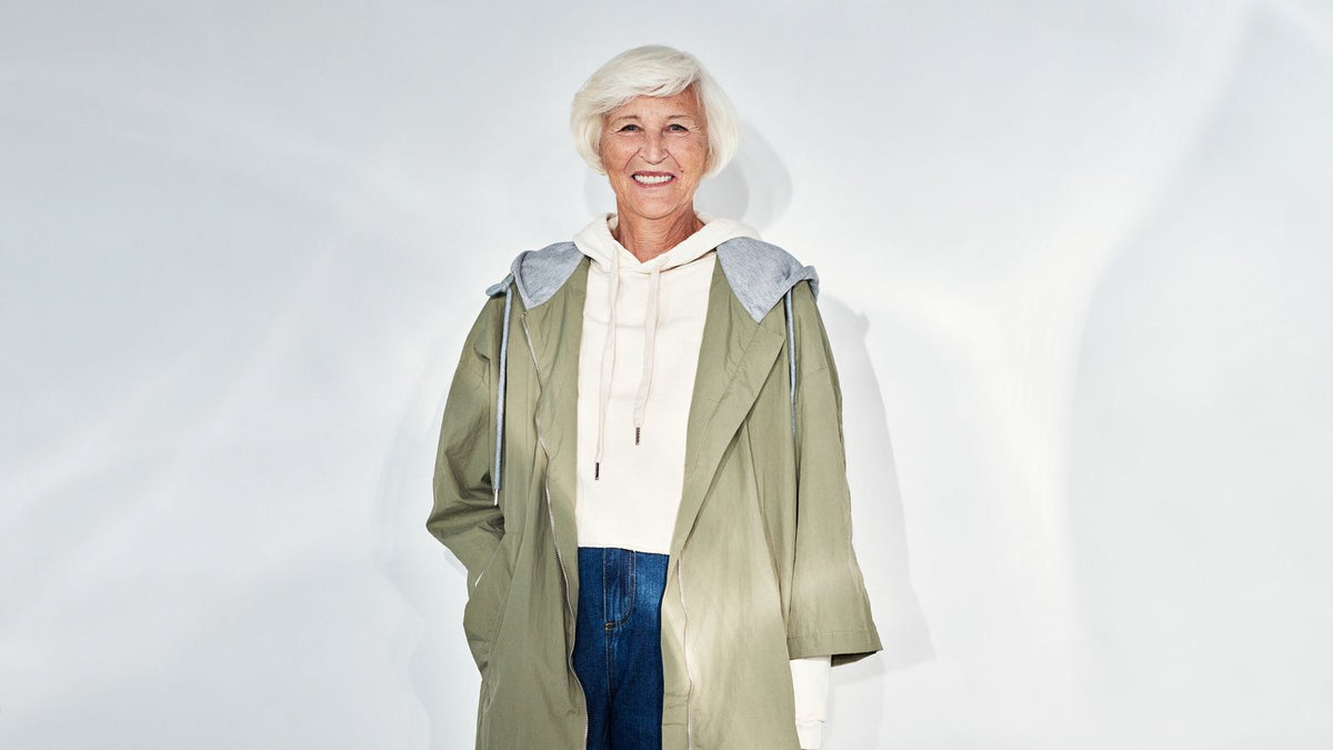 Smiling woman with white hair at the age HRT patches are usually discussed