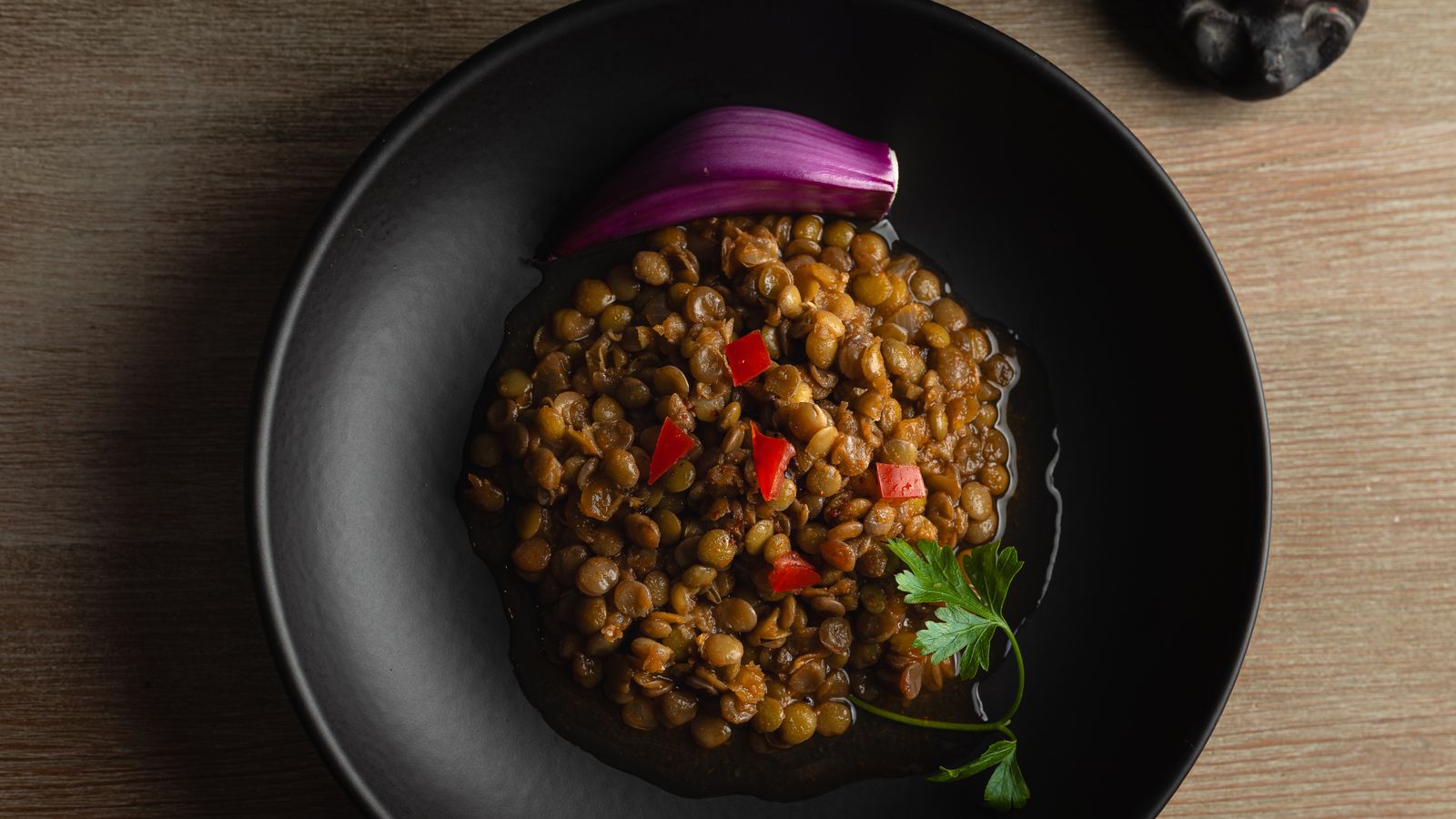 Bowl of lentils, one of the iron rich foods that help increase ferritin levels hair growth depends on