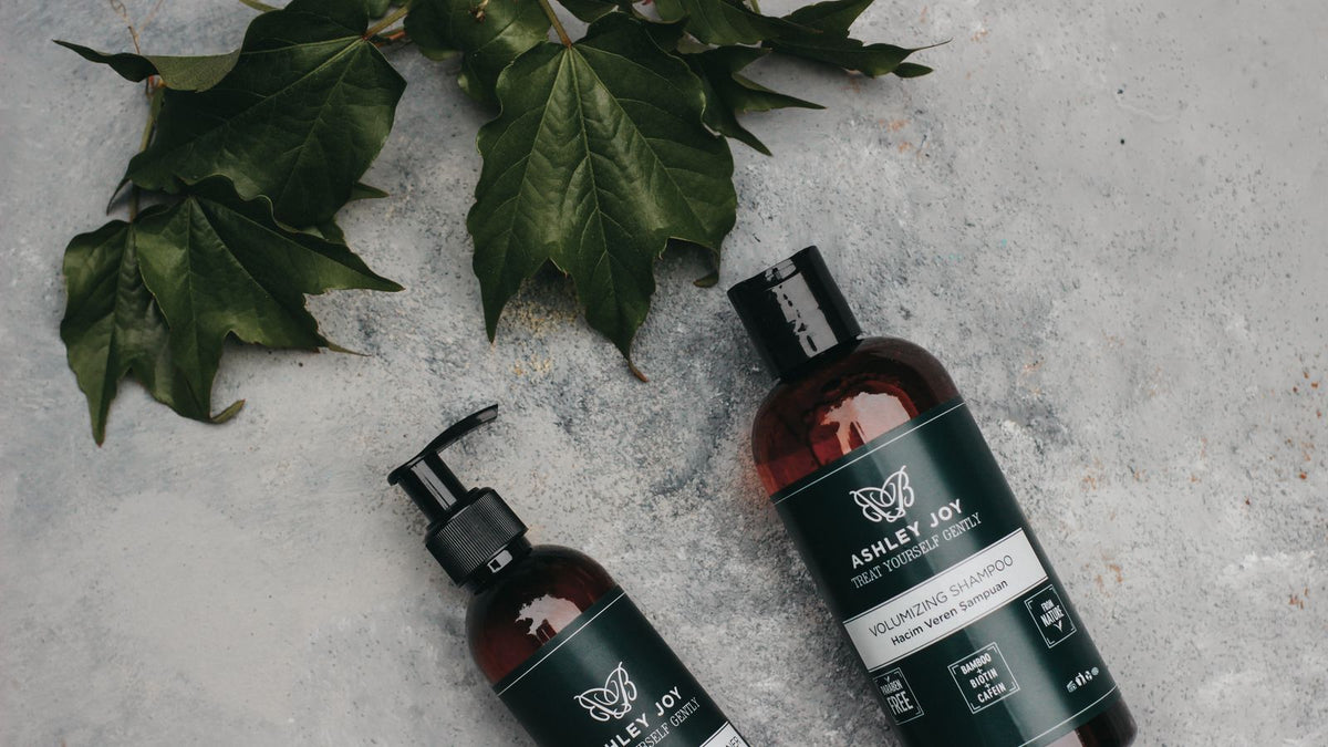 Shampoo and conditioner bottles beside green leaves, weighing up is prell shampoo good for your hair