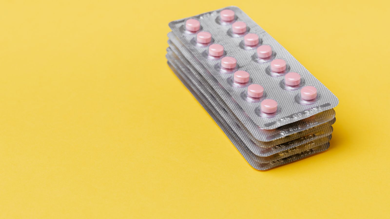 Prescription capsules representing Litfulo ritlecitinib for alopecia areata