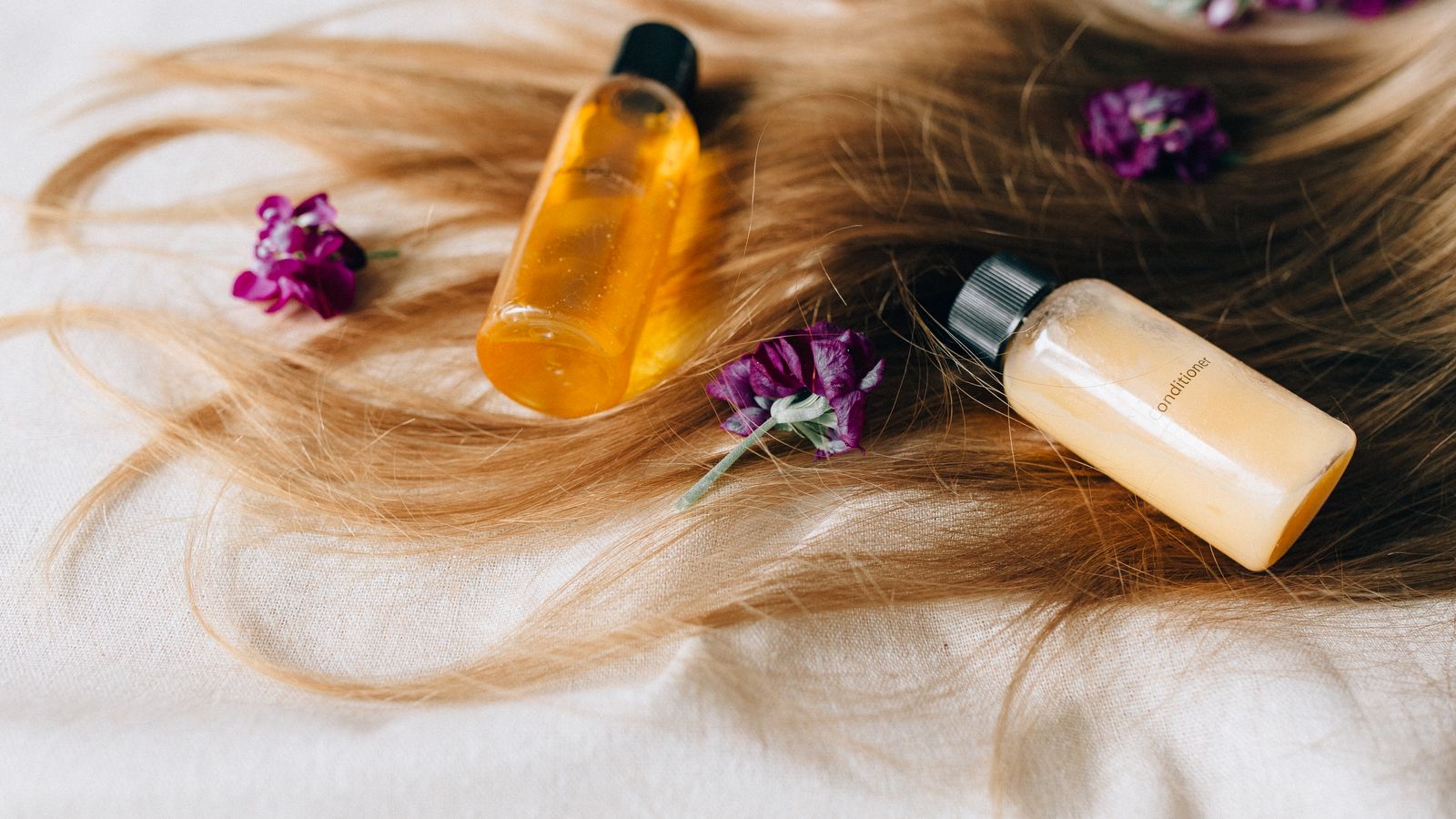 Natural hair care products with flowers for healthy hair growth