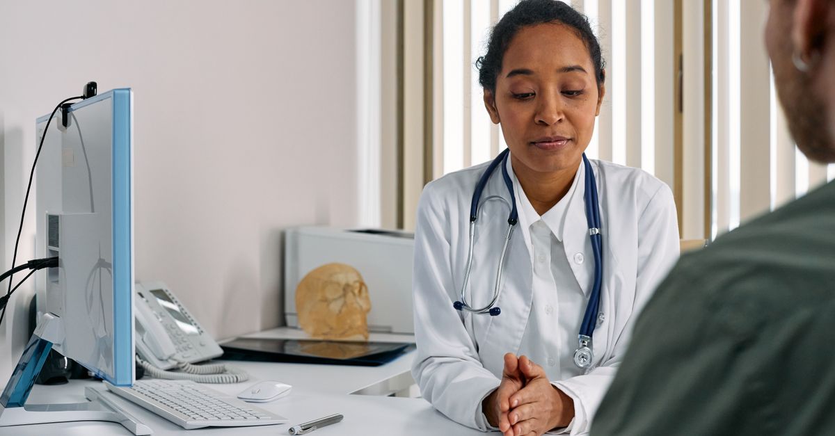 Clinician talking with someone about thyroid related hair loss