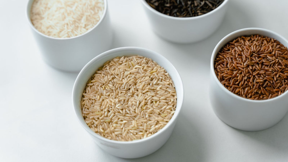 Bowls of rice grains used for rice water rice oil hair treatments made at home