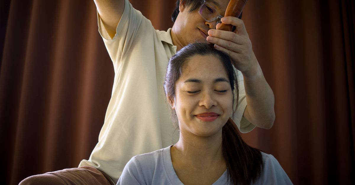 A scalp massage using wooden tools, working the scalp is how scalp build-up is loosened