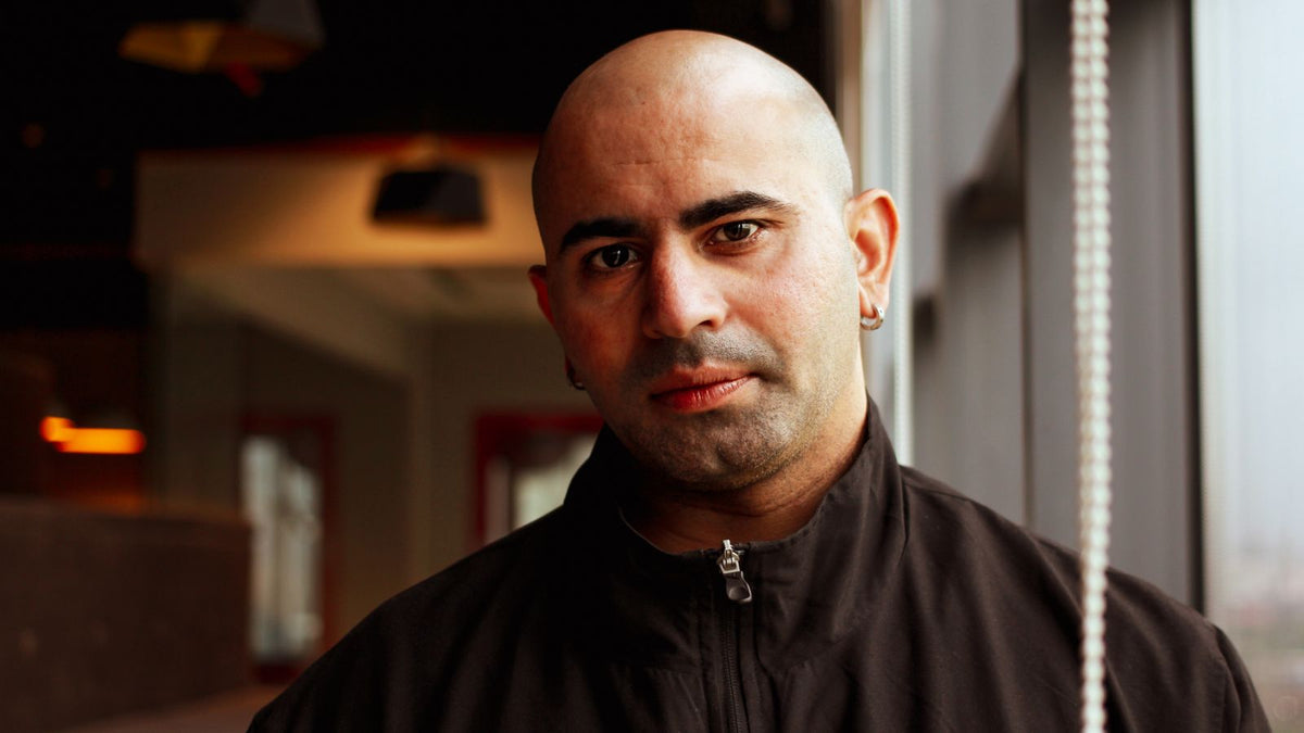Man with a closely shaved head looking confidently at the camera, scalp micropigmentation explained