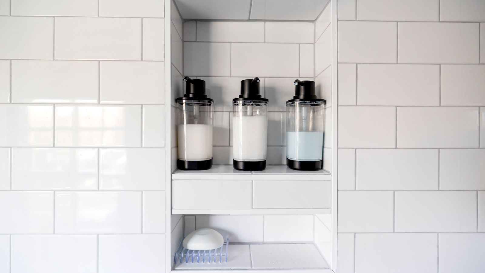 Shampoo and conditioner for fine hair paired on a clean bathroom shelf
