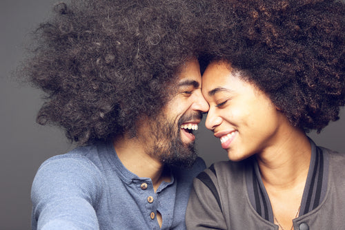 Woman with healthy natural afro hair growing longer