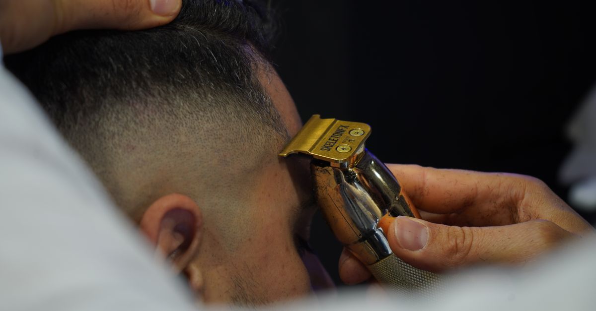 Close up of the scalp and hairline, where spots and bumps on the scalp appear
