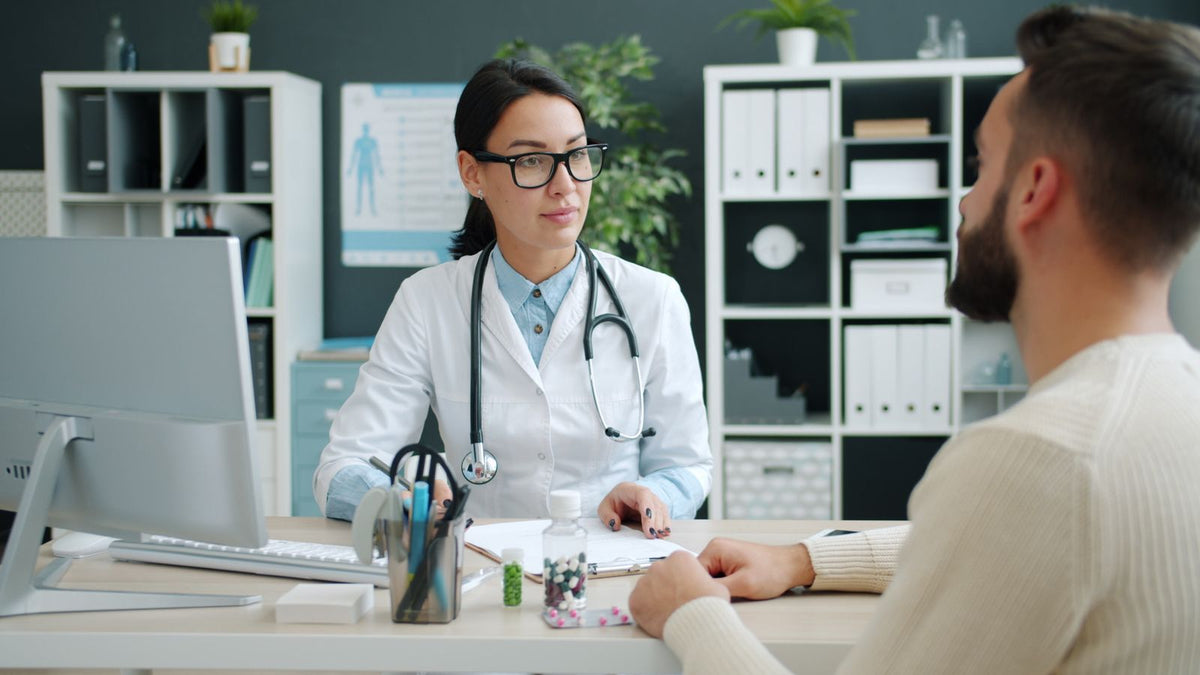 Clinician discussing when to see trichologists Hammersmith urgently