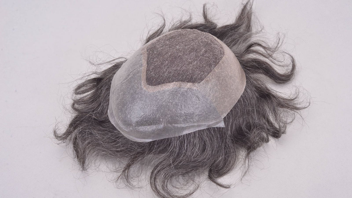 wigs and toppers: a realistic hair topper laid out ready to clip in for fuller-looking hair
