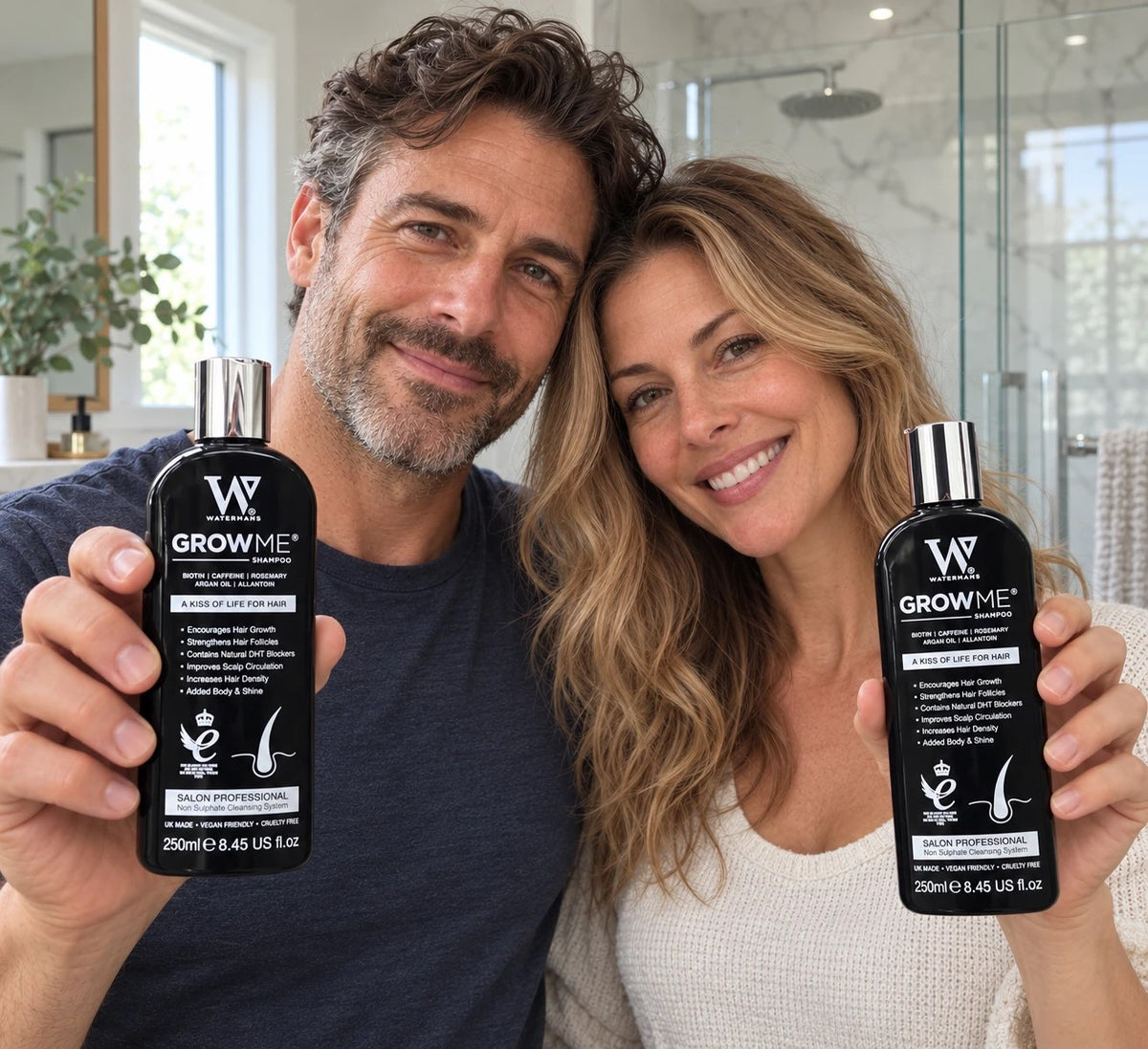 Best shampoo for thinning hair: a man and a woman each holding a bottle of Watermans Grow Me shampoo