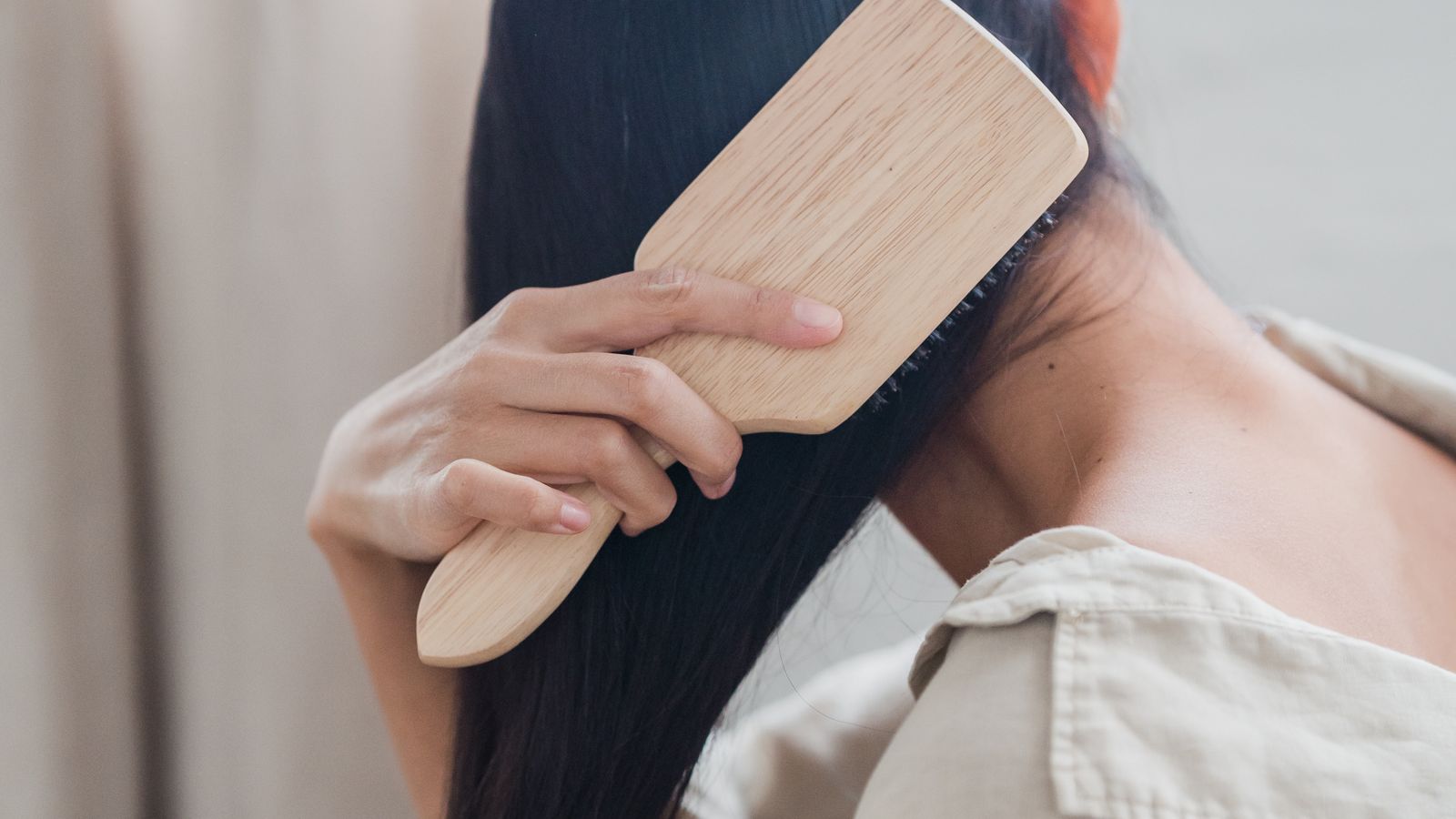 Woman with healthy shiny hair benefiting from niacinamide