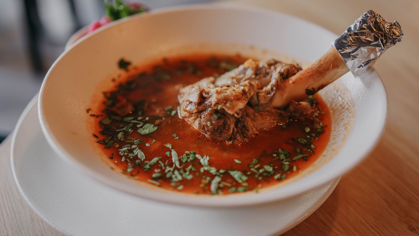 Bowl of bone broth soup, a natural source of collagen for hair growth