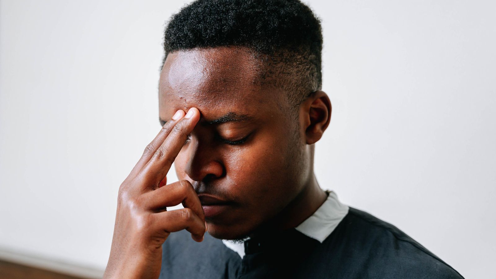 Man considering forehead reduction surgery and hairline lowering options