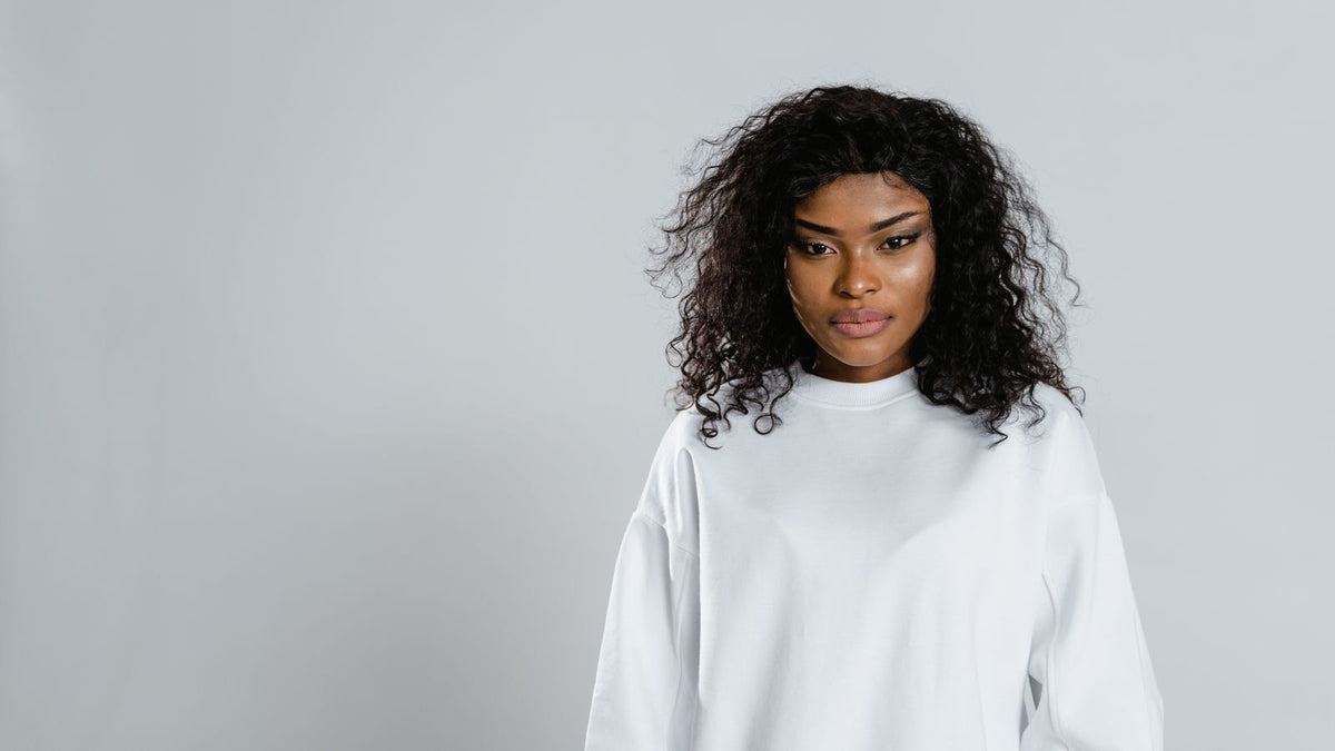 Woman with chemically relaxed hair, where hair breakage after a relaxer starts