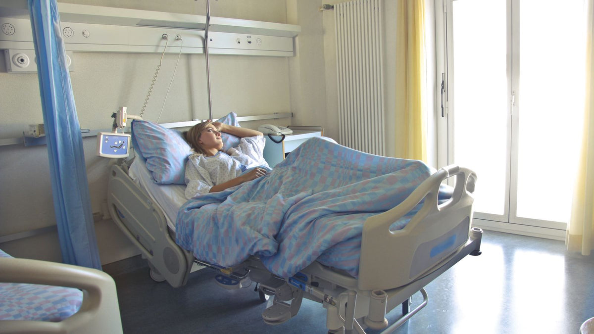 Woman resting at home during recovery, when hair loss after anesthesia surgery often begins