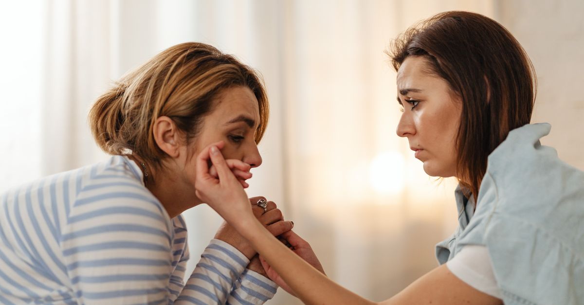Two people comforting each other, the support side of hair loss and mental health