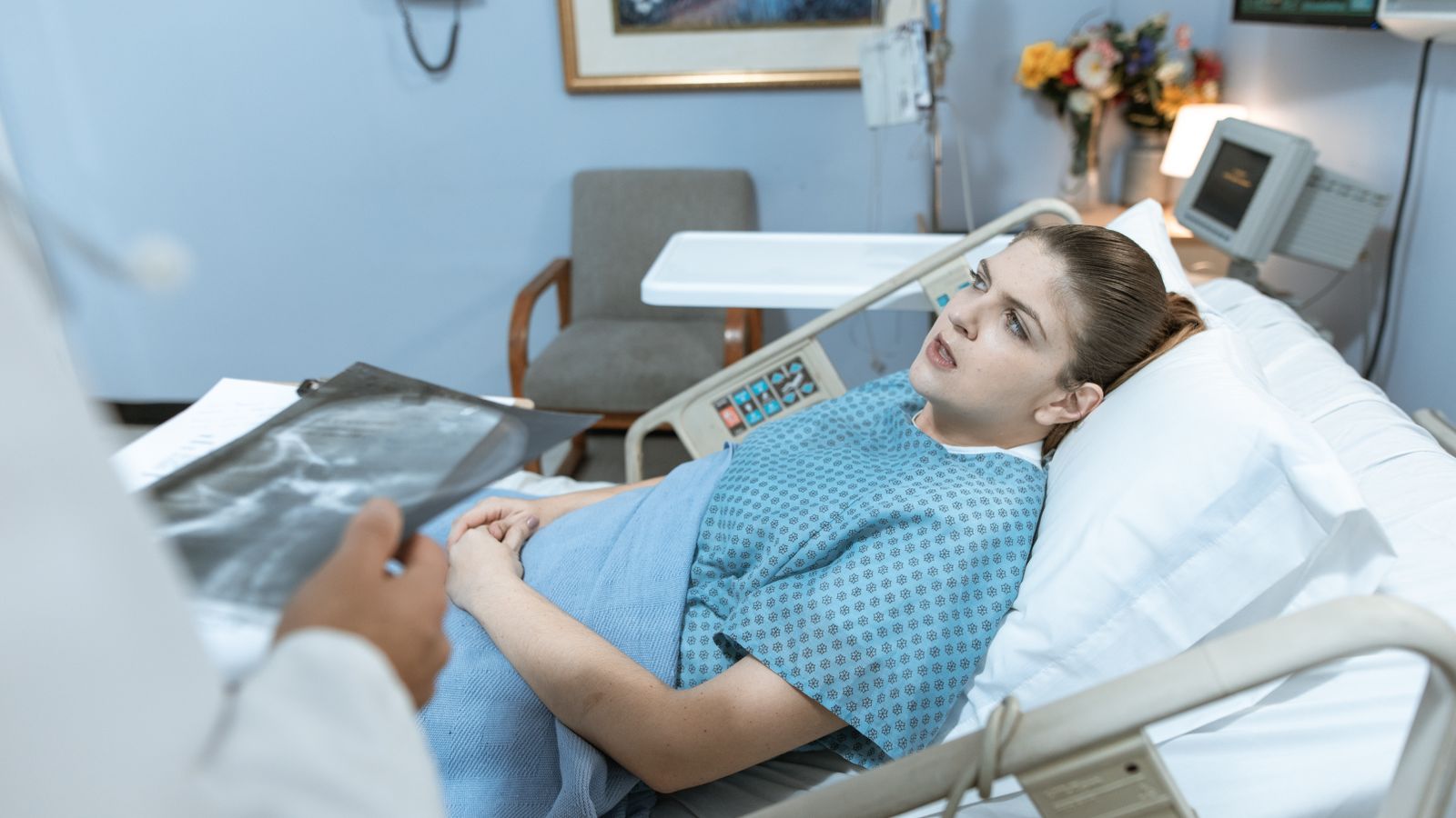 Person recovering in hospital, before hair shedding after surgery begins