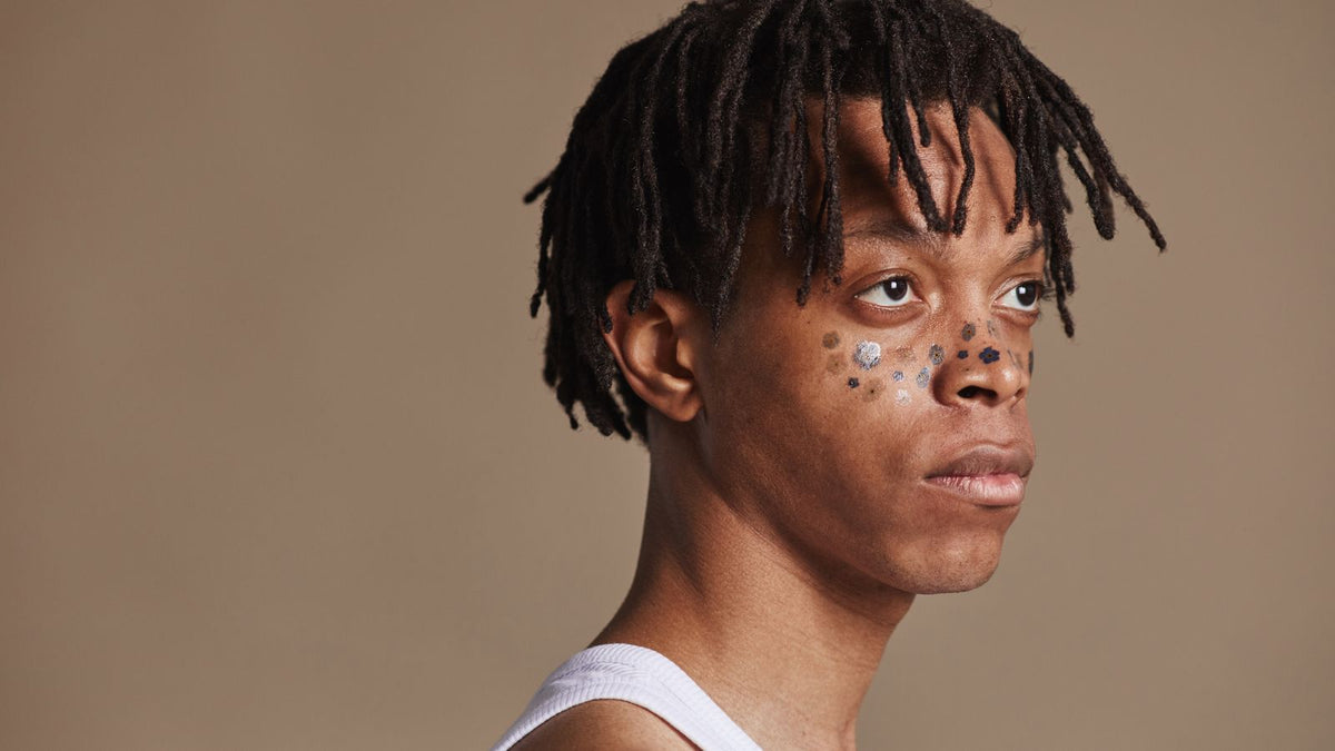 Person with healthy dreadlocks resting neatly on the shoulders