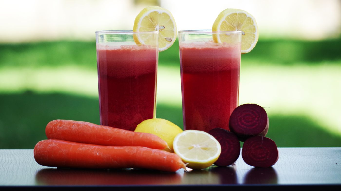 Glasses of fresh beetroot and carrot juice showing healthy juice benefits