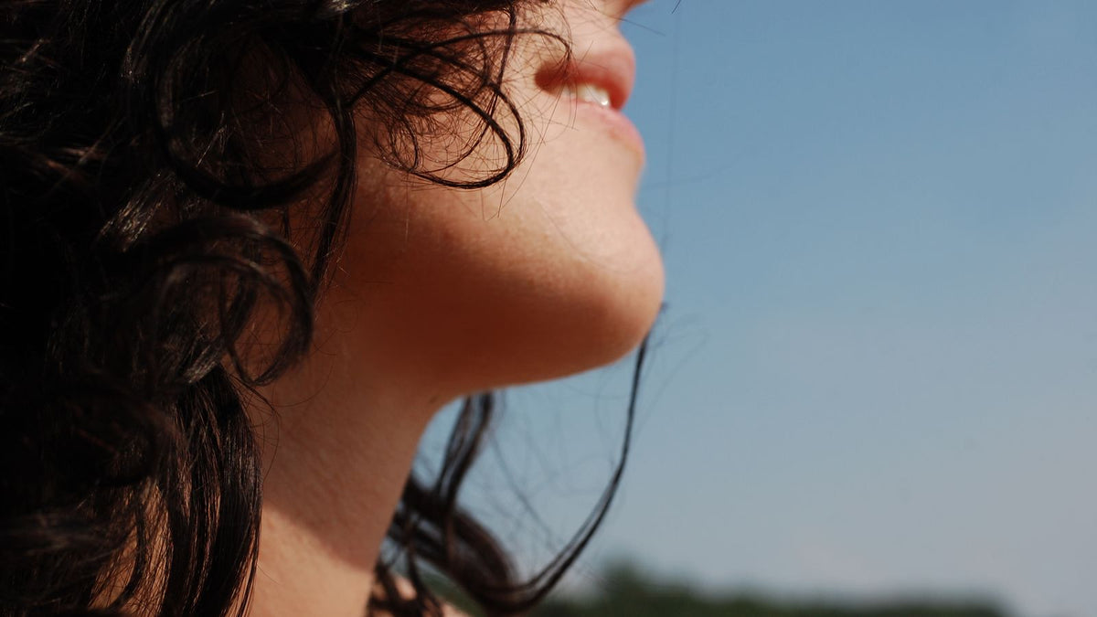 Close-up of a woman's hair showing the texture changes of hormone therapy hair miniaturization