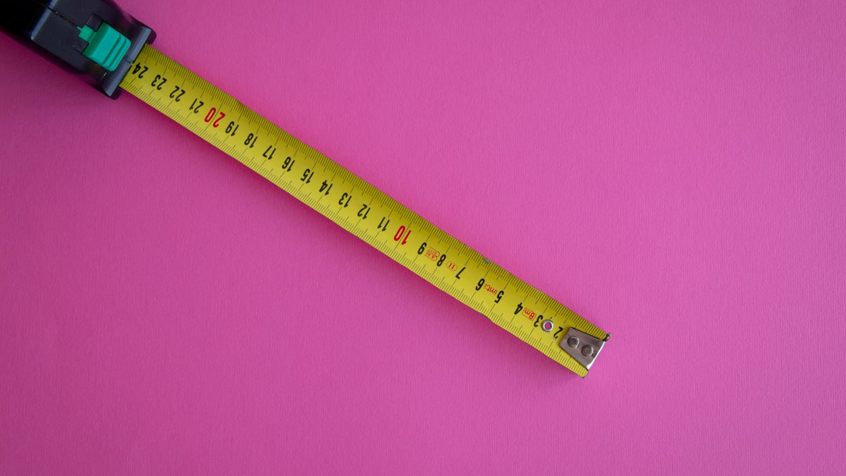 Measuring tape used to check how much does hair grow in a month