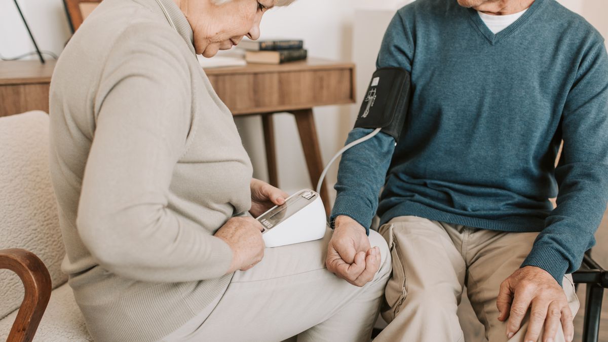 Older couple checking blood pressure at home, the single biggest controllable factor in how to reduce stroke risk