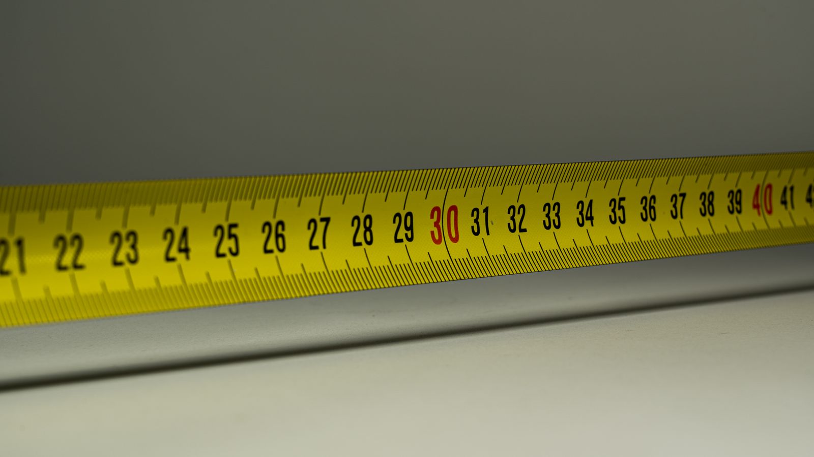 Measuring tape with centimetre markings used to track hair growth accurately