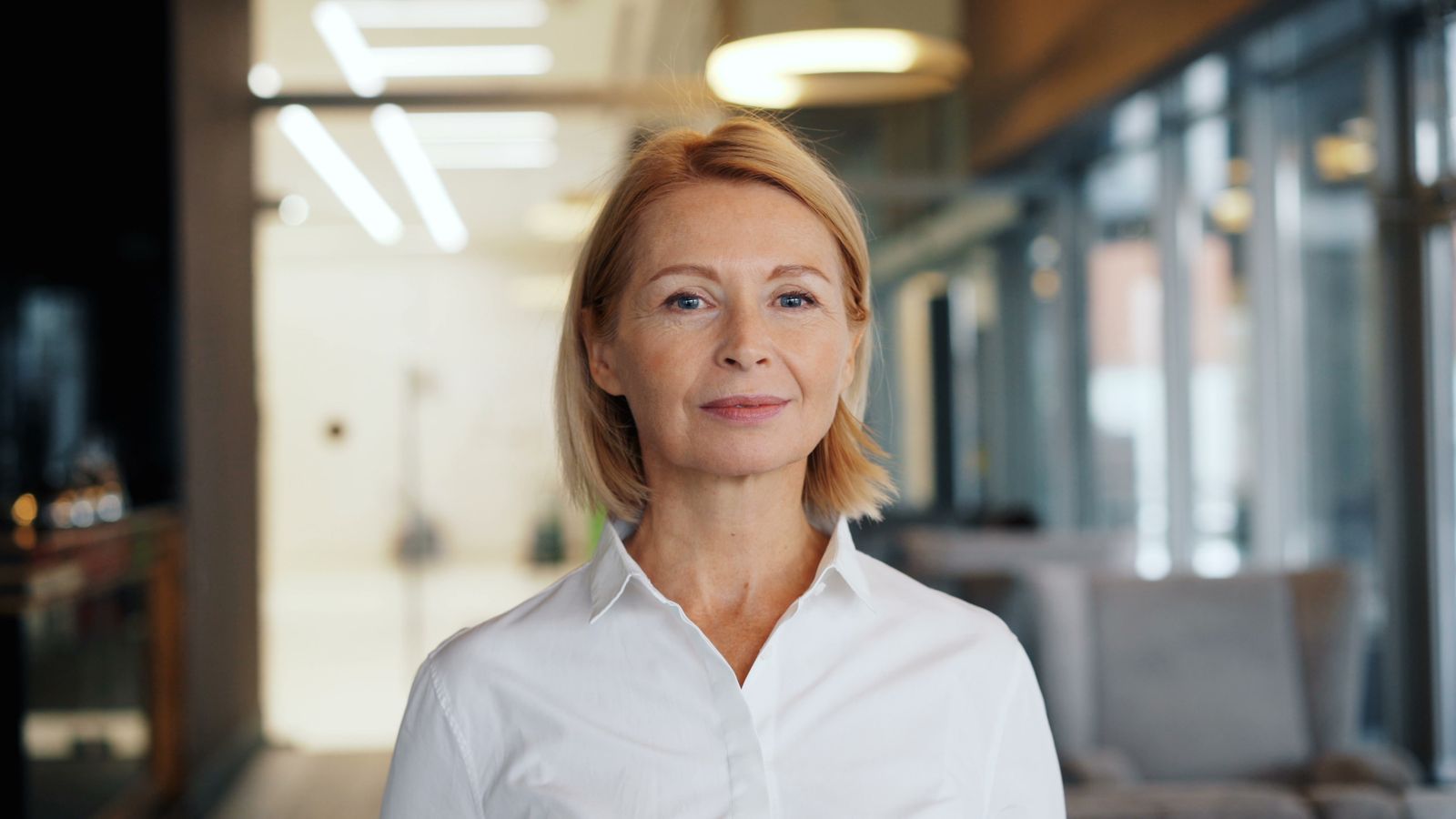 Confident woman in her fifties, the age group most often asking about HRT and hair follicle health