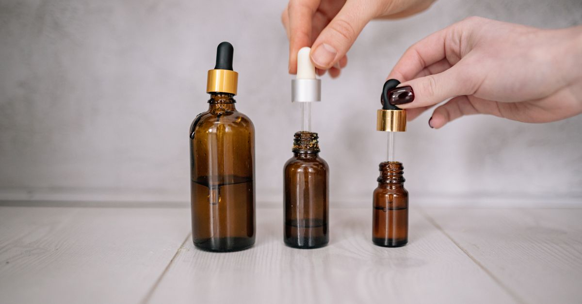 Applying a hyaluronic acid hair serum with a dropper