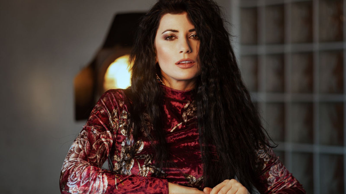 Woman with long dark hair, illustrating how hypertrichosis affects hair growth