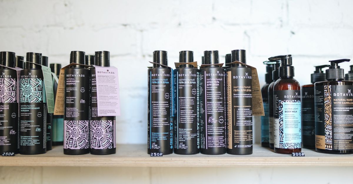 Shampoo and hair care bottles lined up on a shelf