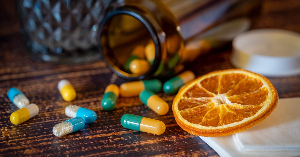 Keratin supplements and other vitamin capsules laid out on a surface