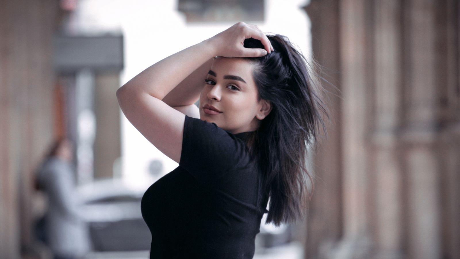 Woman touching her healthy hair, exploring metformin and hair growth