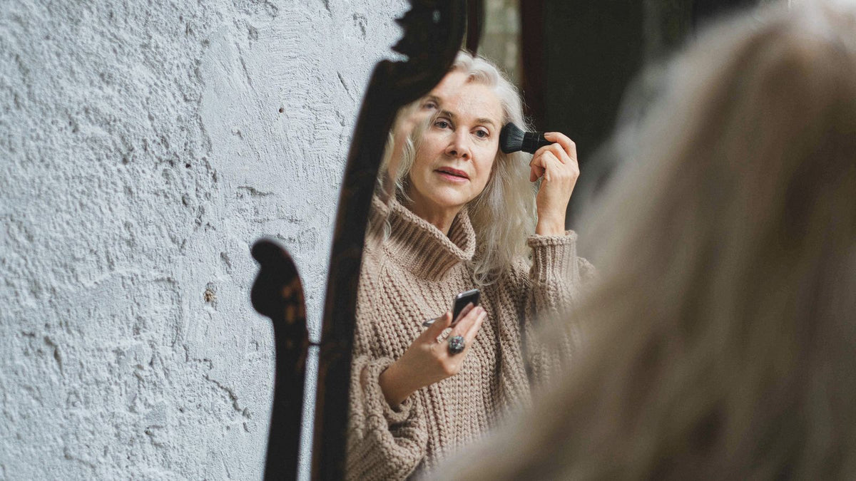Woman at her mirror at the age when oral estrogen is usually discussed