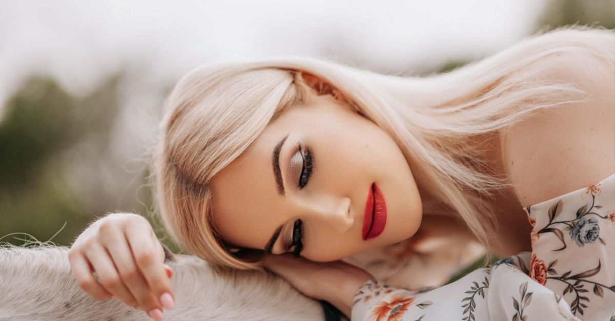 Blonde hair being cared for to repair bleach damage