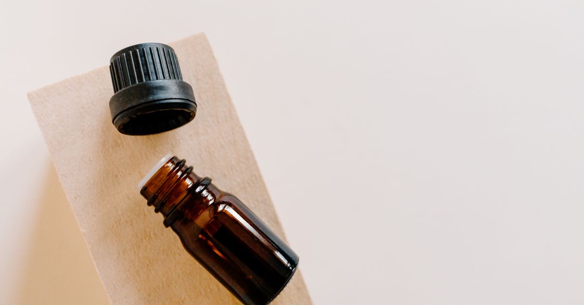 Open bottle of tamanu oil, a rich conditioning hair oil