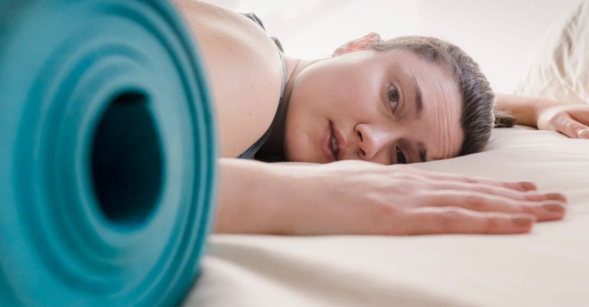 Woman resting in bed recovering after surgery