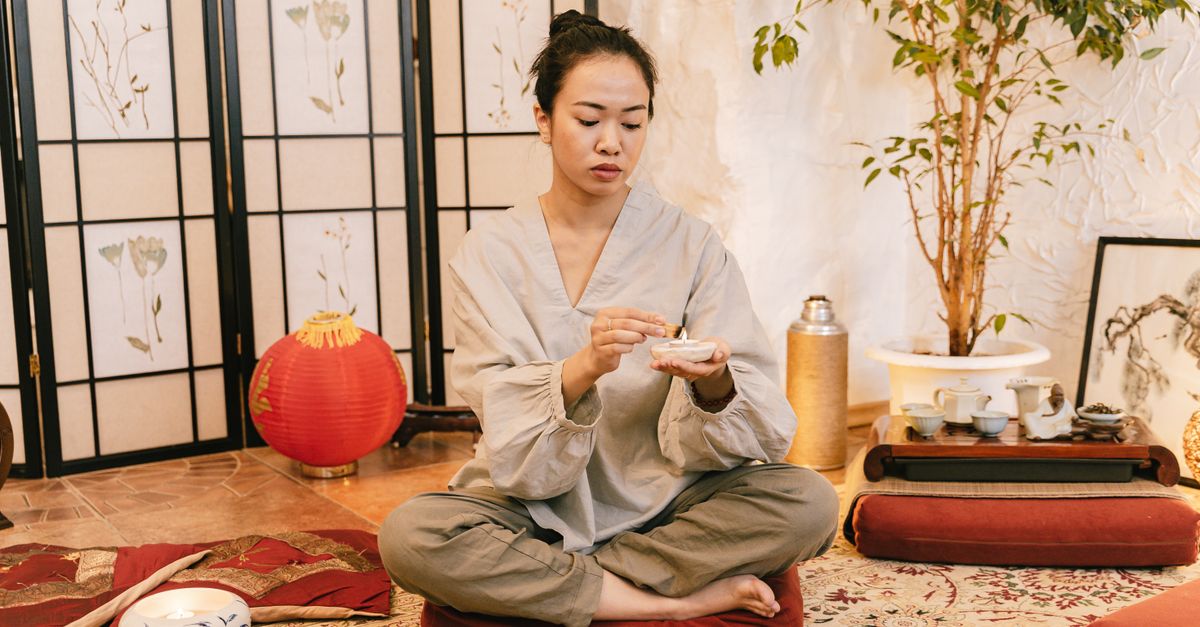 Woman meditating calmly, managing stress and mental health