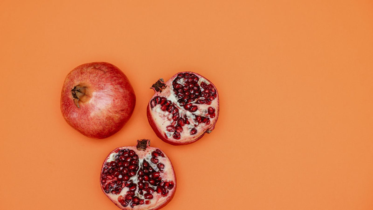 Fresh and sliced pomegranates, pomegranate benefits for hair