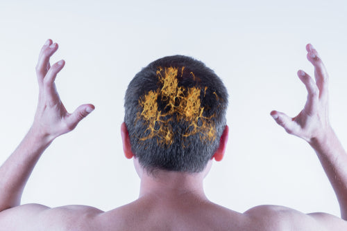 Person soothing a burning, irritated scalp