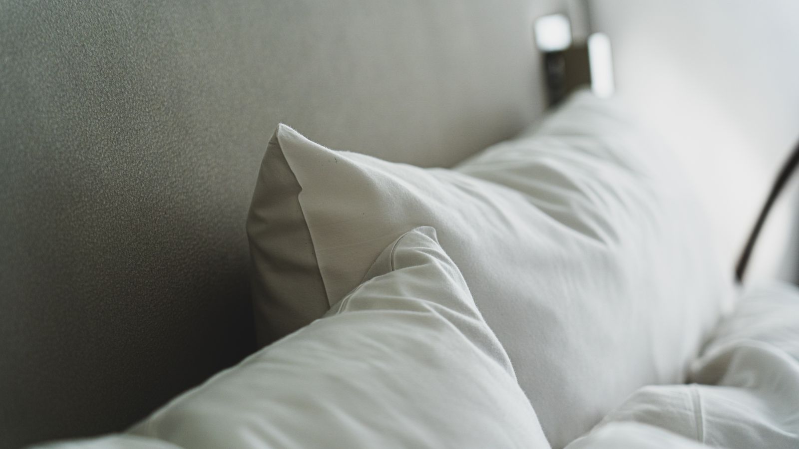 Close-up of smooth bedding, the surface question behind choosing a silk pillowcase for hair