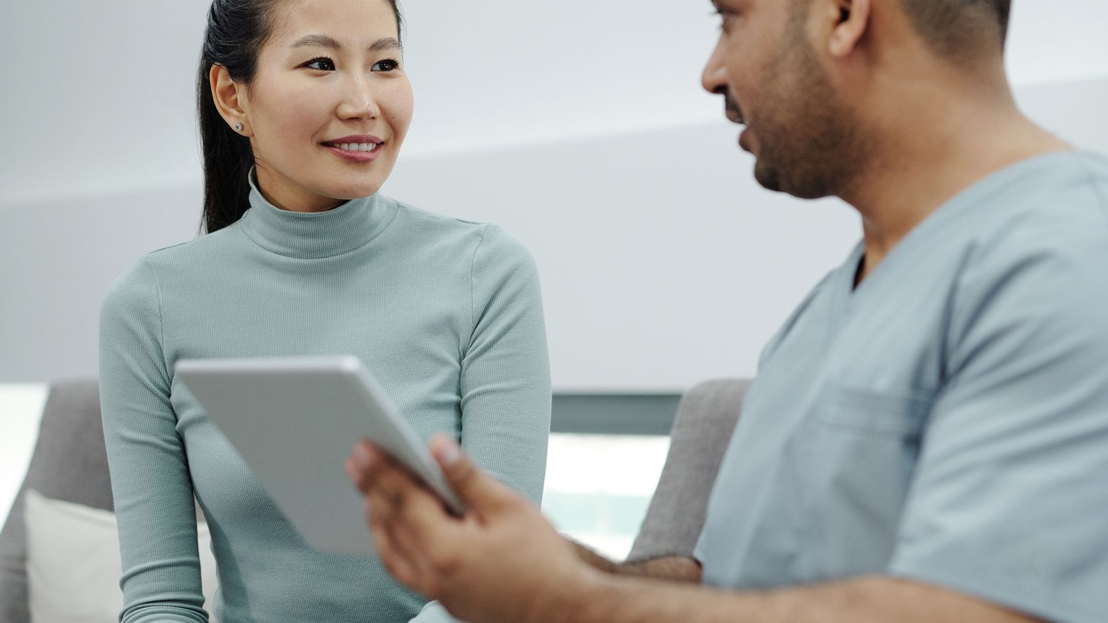 Woman talking to a doctor about thyroid hair loss